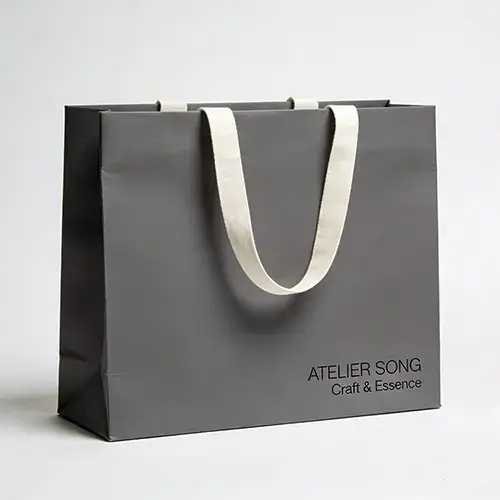 Gray kraft paper bag with ribbon handle