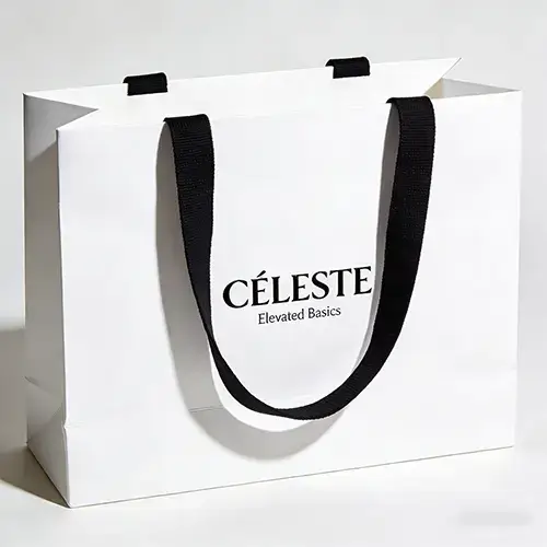 White cardstock bag with black ribbon handle